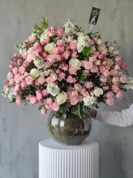 This premium arrangement in a glass vase radiates beauty with elegance.